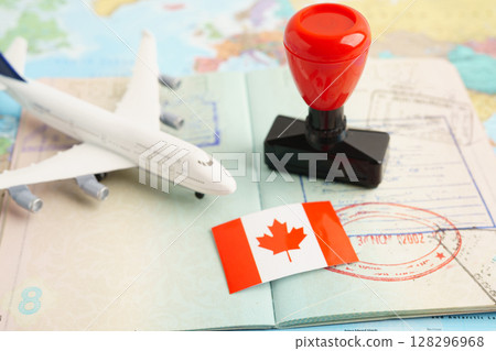 Canada passport with approved stamp on document for tourism to immigration at airport in country. Canada passport with approved stamp on document for tourism to immigration at airport in country. 128296968