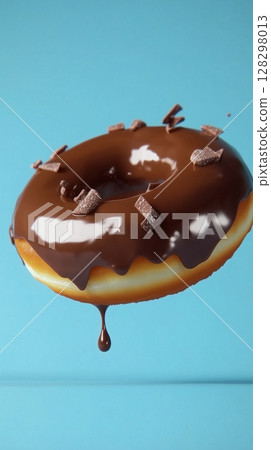 Sweet sprinkle of melted chocolate cream topping donut fries snack food flying for tea time 128298013