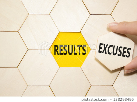 Results or Excuses symbol. Concept word Results or Excuses on wooden comb puzzle. Businessman hand. Beautiful yellow background. Business and Results or Excuses concept. Copy space 128298496