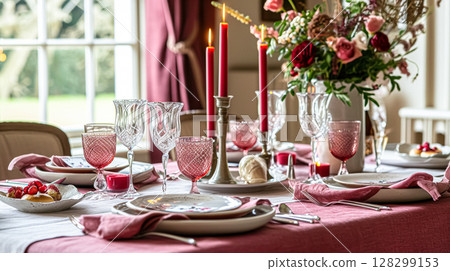 Festive table setting with candles and arrangement of beautiful red flowers. Holiday concept. High quality photo 128299153