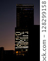 Skyscrapers at night seen between buildings 128299158