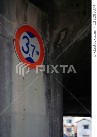 Height restriction sign under the bridge 128299374