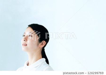 A young woman in an apron A young woman in an apron 128299769