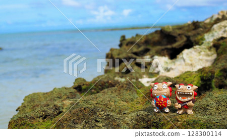 Okinawa's blue sea and smiling shisa landscape photo copy space 128300114