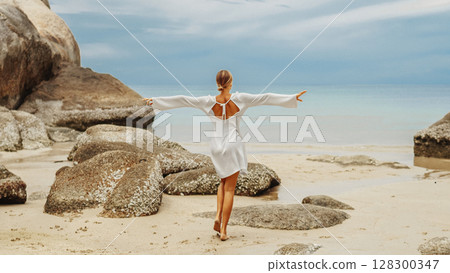 young woman on the beach 128300347