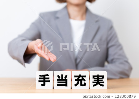 A middle-aged female business woman wearing a suit and a block with ample benefits 128300879