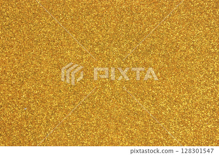 A shimmering gold glitter texture background. A shimmering gold glitter texture background. 128301547