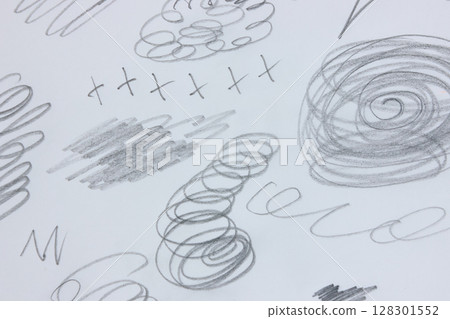 Chaotic pencil scribbles and doodles on white paper. 128301552