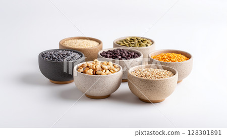 Healthy grains legumes and nuts collection in ceramic bowls for plant based cooking 128301891