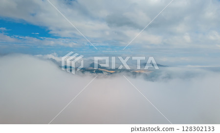 March 2 2025 City View With Mountains and Fog Under a Clear Blue Sky March 2 2025 City View With Mountains and Fog Under a Clear Blue Sky 128302133