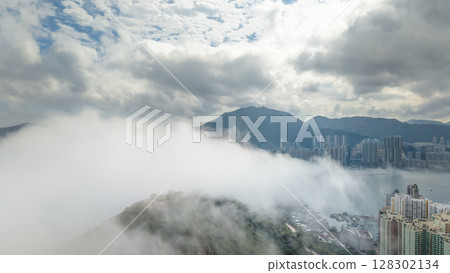 March 2 2025 View of a City With Foggy Mountains and Waterfront March 2 2025 View of a City With Foggy Mountains and Waterfront 128302134