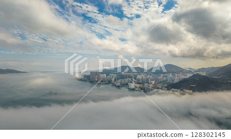 March 2 2025 Cityscape and Vibrant Blue Sky Over Calm Sea March 2 2025 Cityscape and Vibrant Blue Sky Over Calm Sea 128302145
