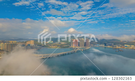 March 2 2025 Skyscrapers Emerging Through Mist in a Mountainous March 2 2025 Skyscrapers Emerging Through Mist in a Mountainous 128302163