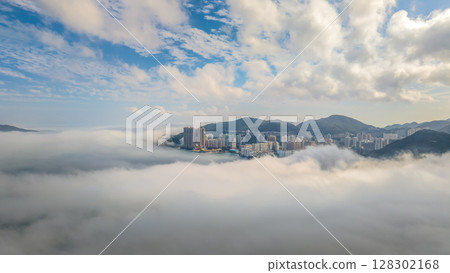 March 2 2025 Cityscape Surrounded by Misty Mountains, Hong Kong March 2 2025 Cityscape Surrounded by Misty Mountains, Hong Kong 128302168