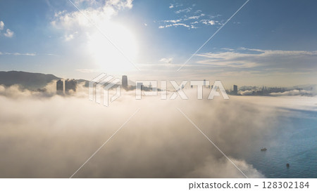 March 2 2025 Urban Skyline Emerging Through Clouds During sunset March 2 2025 Urban Skyline Emerging Through Clouds During sunset 128302184