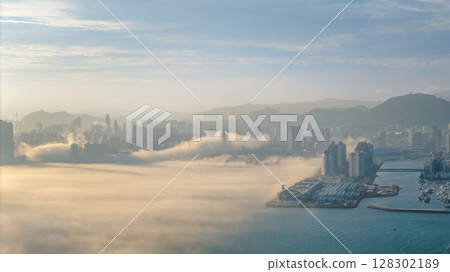 March 2 2025 Foggy Cityscape with Mountains and Water in the Background March 2 2025 Foggy Cityscape with Mountains and Water in the Background 128302189