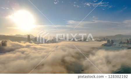 March 2 2025 Urban Skyline Emerging Through Clouds During sunset 128302192