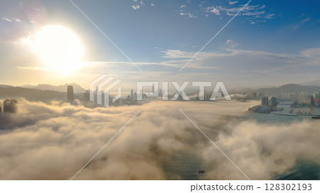 March 2 2025 Urban Skyline Emerging Through Clouds During sunset 128302193