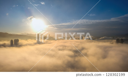 March 2 2025 city skyline with skyscrapers emerging through ethereal clouds March 2 2025 city skyline with skyscrapers emerging through ethereal clouds 128302199