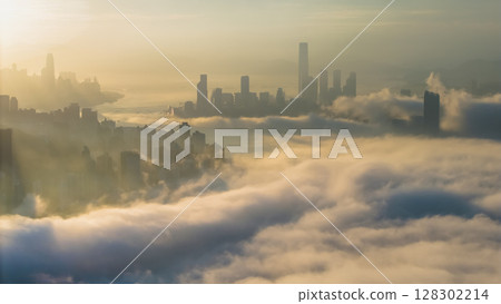 March 2 2025 Captivating Urban Skyline Shrouded in Morning Mist During Sunset 128302214