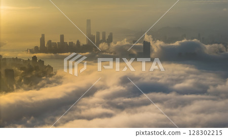 March 2 2025 Captivating Urban Skyline Shrouded in Morning Mist During Sunset 128302215