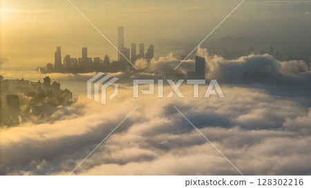 March 2 2025 Captivating Urban Skyline Shrouded in Morning Mist During Sunset 128302216