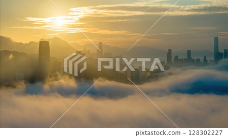 March 2 2025 Captivating Urban Skyline Shrouded in Morning Mist During Sunset 128302227