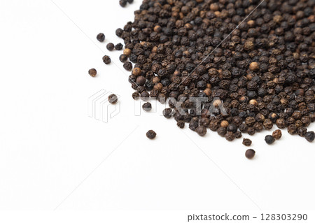 Black pepper on a white background Black pepper on a white background 128303290