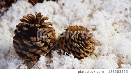 Image of glowing lights moving over fir tree cones christmas decorations 128303553