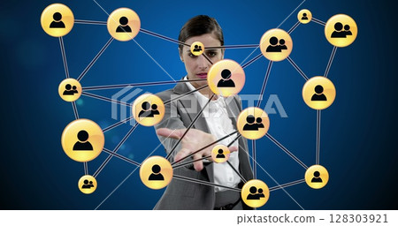Interacting with virtual network, businesswoman focusing on communication in office 128303921