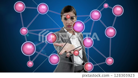 Interacting with virtual network, businesswoman exploring digital connections in office 128303923