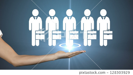 Hand holding digital icons of businesspeople, symbolizing teamwork and leadership 128303929