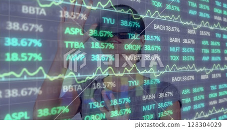 Image of financial data processing over businesswoman using vr headset 128304029