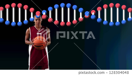 Image of dna strand over female basketball player holding ball Image of dna strand over female basketball player holding ball 128304048