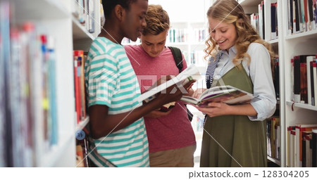 Image of schoolkids reading books in library in school 128304205