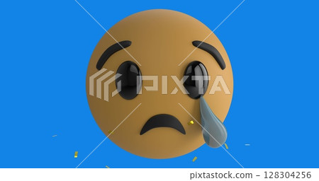 Digital image of golden confetti falling over crying face emoji against blue background 128304256