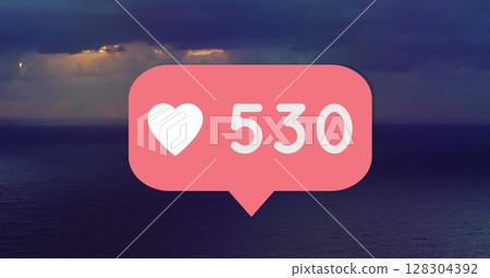 Digital image of heart icon with number text over sky and sea background Digital image of heart icon with number text over sky and sea background 128304392