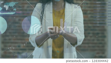 Image of financial data processing over businesswoman disinfecting hands 128304442