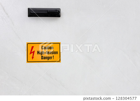 Danger beware electricity sign, Electrical Hazard High Voltage, High-tension sign on metal box and tube. Danger beware electricity sign, Electrical Hazard High Voltage, High-tension sign on metal box and tube. 128304577