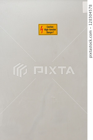 Danger beware electricity sign, Electrical Hazard High Voltage, High-tension sign on metal box and tube. Danger beware electricity sign, Electrical Hazard High Voltage, High-tension sign on metal box and tube. 128304578