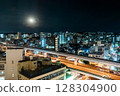 Night view of Naha, Okinawa and the monorail. Cityscape with the moon shining. 128304900