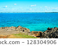 A spectacular view of the emerald blue ocean and rocks of Miyako Island, overlooking the Irabu Bridge 128304906
