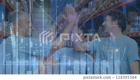 Image of statistics and financial data processing over men and woman high fiving in warehouse Image of statistics and financial data processing over men and woman high fiving in warehouse 128305384