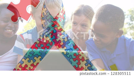 Image of colorful puzzle pieces ribbon over happy playing children 128305511