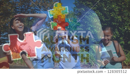 Image of autism awareness text and colorful puzzle pieces over happy playing children 128305512