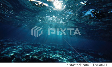 serene underwater scene with the sun's rays piercing through the ocean surface 128306110