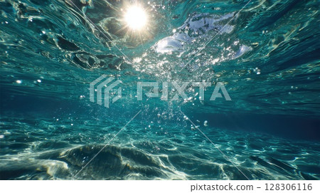serene underwater scene with the sun's rays piercing through the ocean surface serene underwater scene with the sun's rays piercing through the ocean surface 128306116