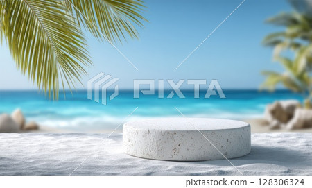 Beach sand with palm leaves and blue sky with a white stone podium in the foreground 128306324