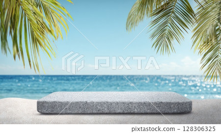 Beach sand with palm leaves and blue sky with a white stone podium in the foreground 128306325