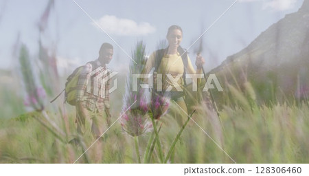 Image of happy african american couple hiking over landscape in sun 128306460